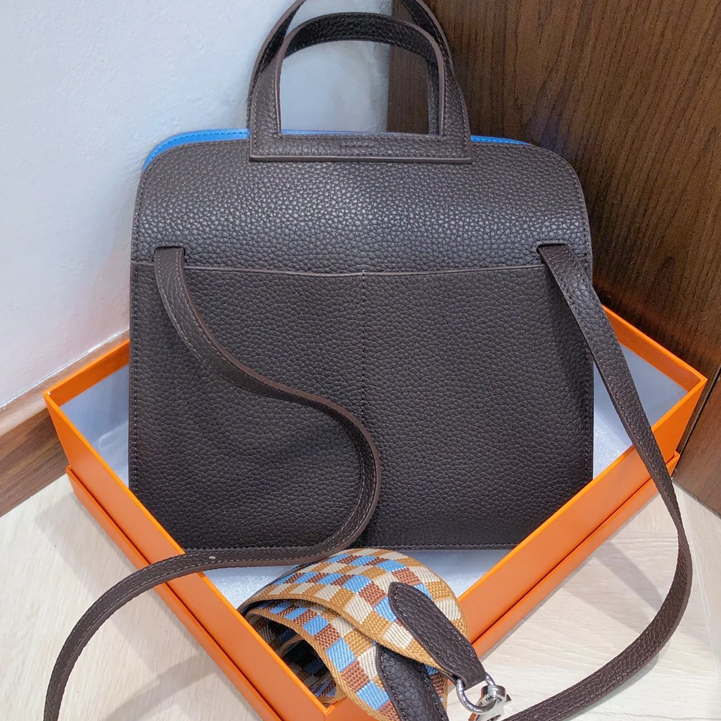 Deep Earthy Brown Vivid Bright Blue Color Block Compact Rectangular Flap Bag With Sleek Silvery Buckle Hardware And Dual Separate Carrying Straps