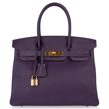Deep Ripe Grape Textured Medium Structured Trapezoid Hand Tote With Luminous Warm Golden Twist Lock Hardware And Matching Suspended Engraved Metal Padlock Charm